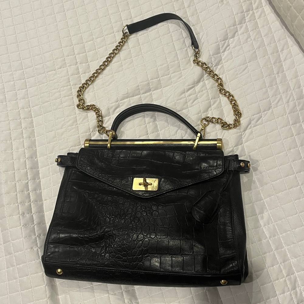 Elegant Black leather Handbag with Gold Chain by BCBGMAXAZRIA.